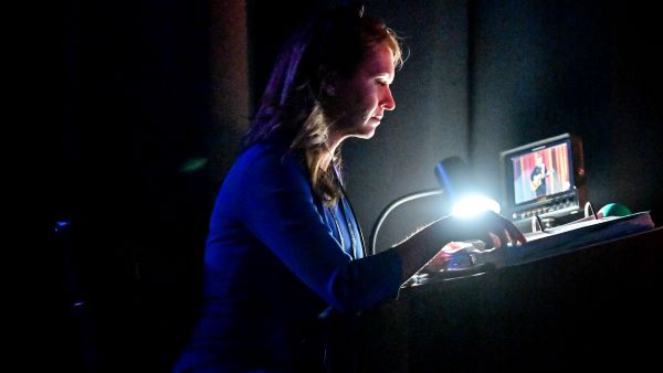 Corvias Operations Director Amber Moser volunteers as a stage director at the annual Oklahoma State Future Farmers of America convention