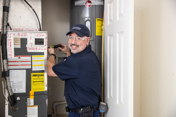 Maintenance Person Fixes HVAC equipment for optimal efficiency